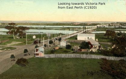 Hand painted postcard of the Causeway (C1920) Photographed from East Perth looking south. Note the tram and the hump on the Causeway which allowed steam boats to lower their chimneys to go up the River Swan to Guildford. Victoria Park WA is seen in the distance.
